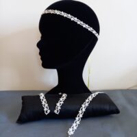 Ensemble bijoux frivolité en passiflore ivoirecomposé d'une paire de boucles d'oreilles longues d'un bandeau et d'un pendentif